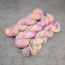 Load image into Gallery viewer, Desert Rainbow - Hand Dyed DK Weight Superwash Merino Wool and Silk Yarn, UV Reactive Pastel Rainbow Black Speckle, 245 Yards (224 Meters)
