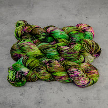 Load image into Gallery viewer, Witch in the Woods - Hand Dyed Super Sock Fingering Weight 75/25 Merino Wool Nylon Yarn, UV Reactive Green Purple, 463 Yards (423 Meters)
