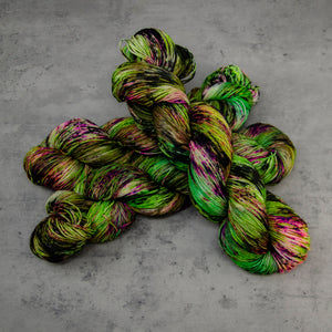 Witch in the Woods - Hand Dyed Super Sock Fingering Weight 75/25 Merino Wool Nylon Yarn, UV Reactive Green Purple, 463 Yards (423 Meters)