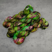 Load image into Gallery viewer, Witch in the Woods - Hand Dyed Super Sock Fingering Weight 75/25 Merino Wool Nylon Yarn, UV Reactive Green Purple, 463 Yards (423 Meters)
