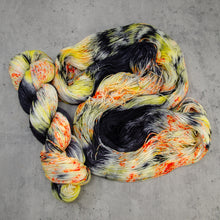 Load image into Gallery viewer, H’ween - Hand Dyed Super Sock Fingering Weight 75/25 Merino Wool Nylon Yarn, UV Reactive Black Orange Yellow, 463 Yards (423 Meters)
