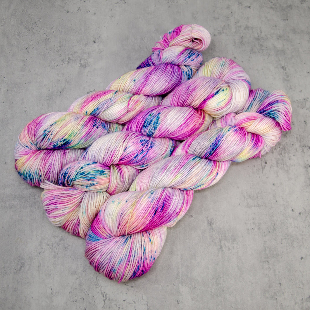 Roseate - Hand Dyed Feather Fingering Weight, SW Merino Wool, Baby Alpaca, Silk Yarn, UV Reactive Pink Cream Multi, 437 Yards (400 M)