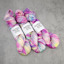Load image into Gallery viewer, Roseate - Hand Dyed Super Sock, Fingering Weight 75/25 Merino Nylon Yarn, UV Reactive Pink Cream Multi Speckled, 463 Yards (423 Meters)
