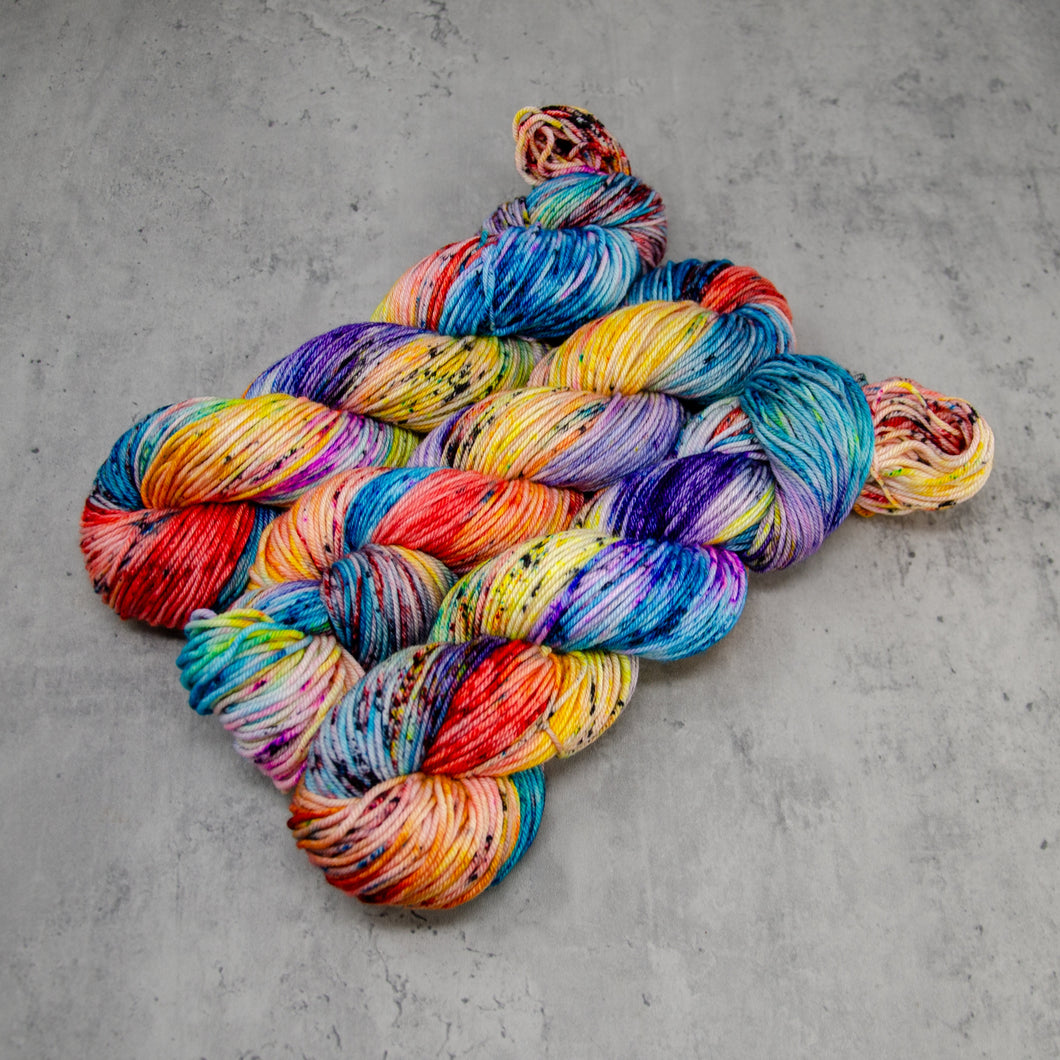 Primarily - Hand Dyed DK Weight Superwash Merino Wool and Silk Yarn, Bright Random Rainbow with Black Speckle, 245 Yards (224 Meters)